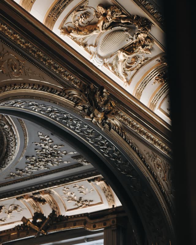 Detail of gilded boiserie and carved moulding in a Parisian salon